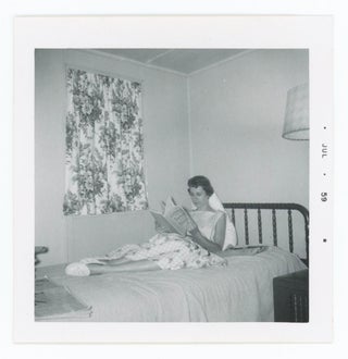 Item #30678 Snapshot of a Woman Reading on A Bed. Anonymous
